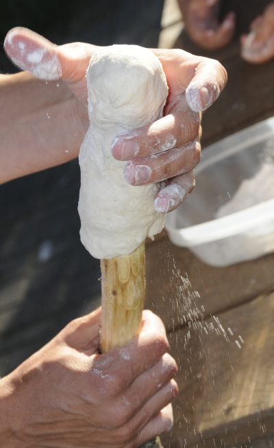 bannock formed to cooking stick