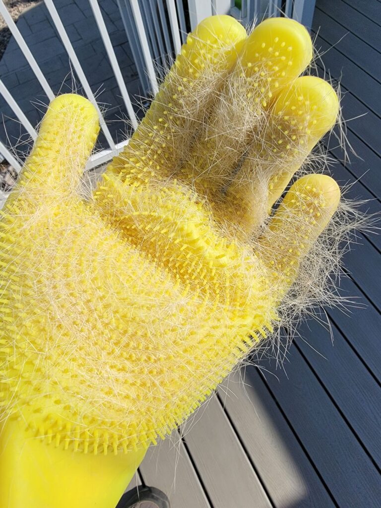 FurZapper pet grooming glove has soft bristles for removing loose hair. A close-up picture